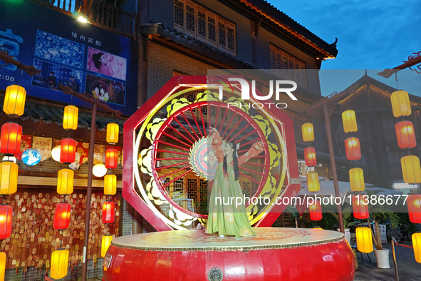 Tourists are enjoying Tea Horse Ancient City in Pu'er, Yunnan province, China, on July 1, 2024. 