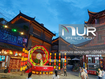 Tourists are enjoying Tea Horse Ancient City in Pu'er, Yunnan province, China, on July 1, 2024. (