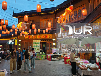 Tourists are enjoying Tea Horse Ancient City in Pu'er, Yunnan province, China, on July 1, 2024. (