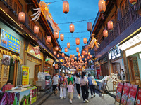 Tourists are enjoying Tea Horse Ancient City in Pu'er, Yunnan province, China, on July 1, 2024. (