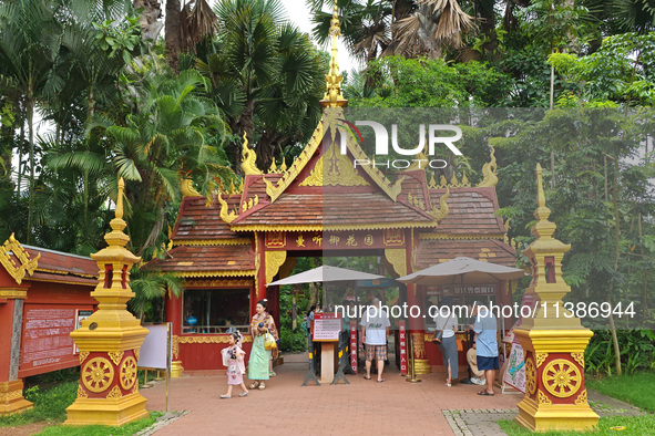 Tourists are enjoying the scenery in the Manting Imperial Garden in Xishuangbanna, China, on July 3, 2024. 