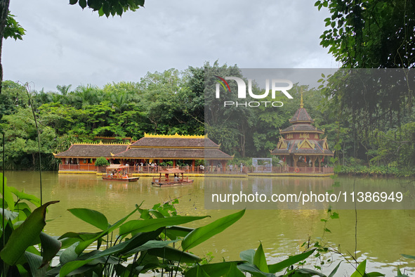 Tourists are enjoying the scenery in the Manting Imperial Garden in Xishuangbanna, China, on July 3, 2024. 