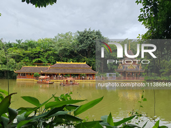 Tourists are enjoying the scenery in the Manting Imperial Garden in Xishuangbanna, China, on July 3, 2024. (