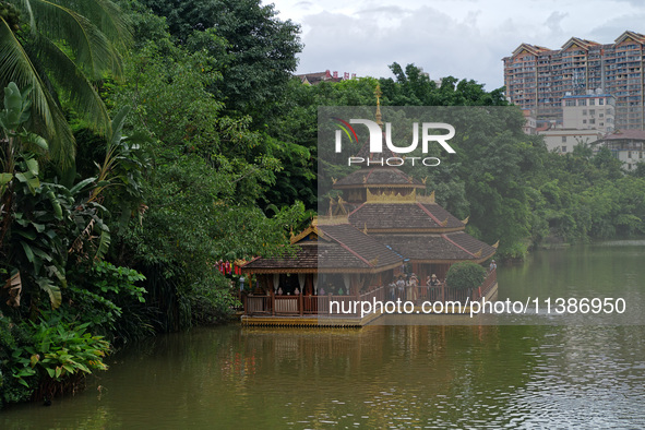 Tourists are enjoying the scenery in the Manting Imperial Garden in Xishuangbanna, China, on July 3, 2024. 