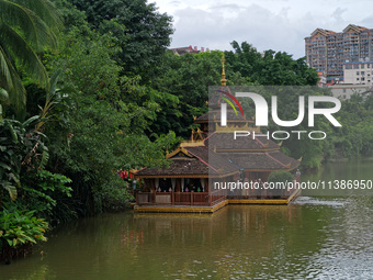 Tourists are enjoying the scenery in the Manting Imperial Garden in Xishuangbanna, China, on July 3, 2024. (