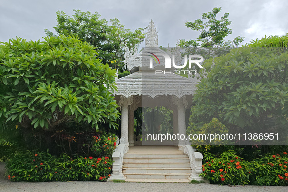 Tourists are enjoying the scenery in the Manting Imperial Garden in Xishuangbanna, China, on July 3, 2024. 