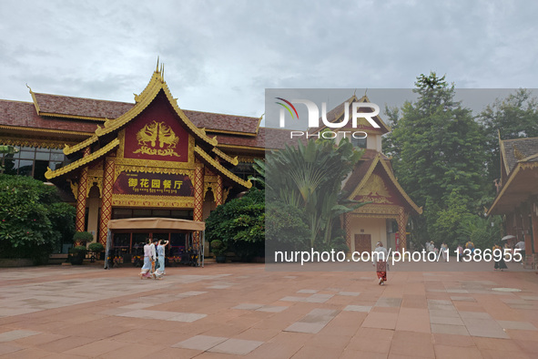 Tourists are enjoying the scenery in the Manting Imperial Garden in Xishuangbanna, China, on July 3, 2024. 