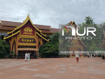 Tourists are enjoying the scenery in the Manting Imperial Garden in Xishuangbanna, China, on July 3, 2024. (