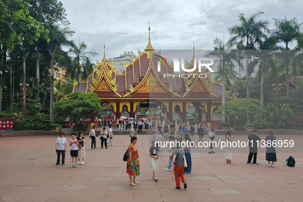 Tourists are enjoying the scenery in the Manting Imperial Garden in Xishuangbanna, China, on July 3, 2024. 