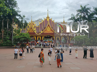 Tourists are enjoying the scenery in the Manting Imperial Garden in Xishuangbanna, China, on July 3, 2024. (