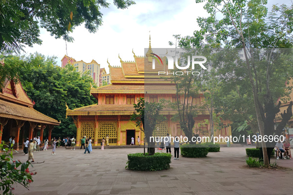 Tourists are enjoying the scenery in the Manting Imperial Garden in Xishuangbanna, China, on July 3, 2024. 