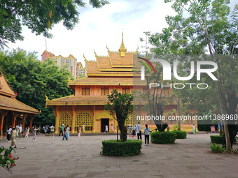 Tourists are enjoying the scenery in the Manting Imperial Garden in Xishuangbanna, China, on July 3, 2024. (