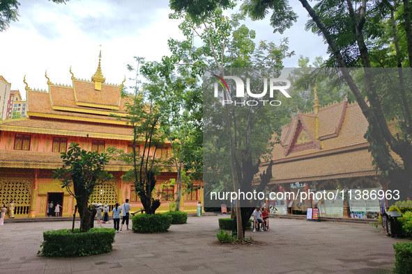 Tourists are enjoying the scenery in the Manting Imperial Garden in Xishuangbanna, China, on July 3, 2024. 