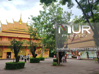 Tourists are enjoying the scenery in the Manting Imperial Garden in Xishuangbanna, China, on July 3, 2024. (