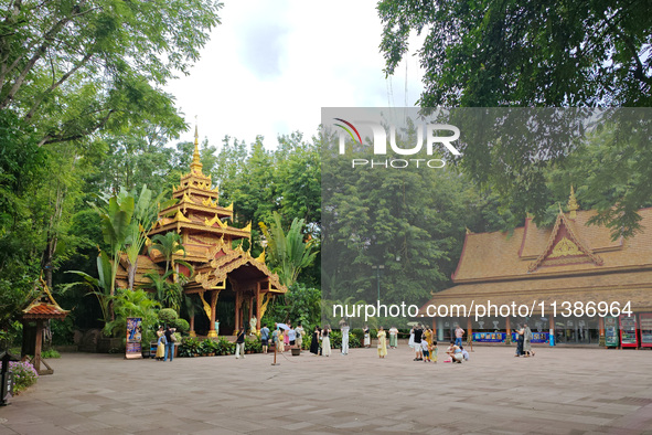 Tourists are enjoying the scenery in the Manting Imperial Garden in Xishuangbanna, China, on July 3, 2024. 