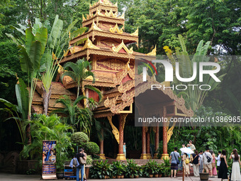 Tourists are enjoying the scenery in the Manting Imperial Garden in Xishuangbanna, China, on July 3, 2024. (