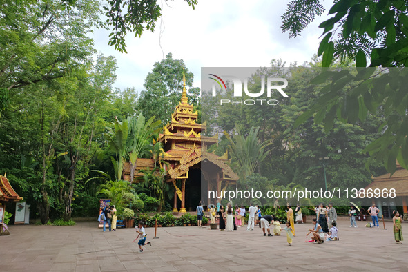 Tourists are enjoying the scenery in the Manting Imperial Garden in Xishuangbanna, China, on July 3, 2024. 