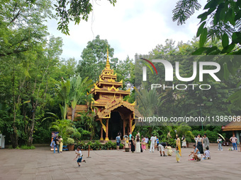 Tourists are enjoying the scenery in the Manting Imperial Garden in Xishuangbanna, China, on July 3, 2024. (