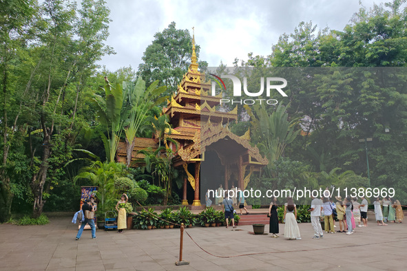 Tourists are enjoying the scenery in the Manting Imperial Garden in Xishuangbanna, China, on July 3, 2024. 