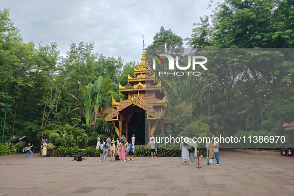 Tourists are enjoying the scenery in the Manting Imperial Garden in Xishuangbanna, China, on July 3, 2024. 