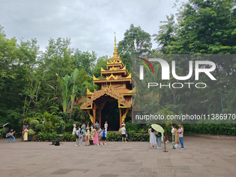 Tourists are enjoying the scenery in the Manting Imperial Garden in Xishuangbanna, China, on July 3, 2024. (