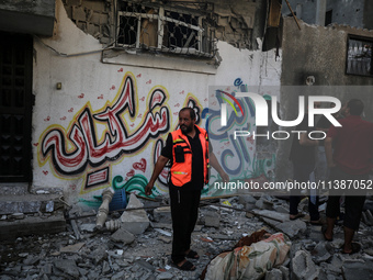 Palestinians are checking the destruction after an Israeli strike the previous day on a house in the Nuseirat refugee camp in the central Ga...