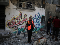 Palestinians are checking the destruction after an Israeli strike the previous day on a house in the Nuseirat refugee camp in the central Ga...