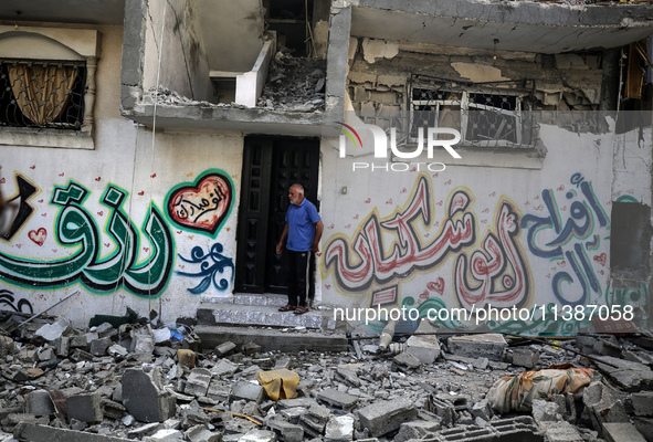 Palestinians are checking the destruction after an Israeli strike the previous day on a house in the Nuseirat refugee camp in the central Ga...