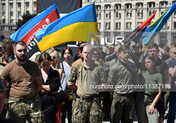 People are taking part in a funeral ceremony for British volunteer and combat medic Peter Fouche at Independence Square in Kyiv, Ukraine, on...