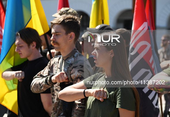 People are shouting slogans during a funeral ceremony for British volunteer and combat medic Peter Fouche at Independence Square in Kyiv, Uk...