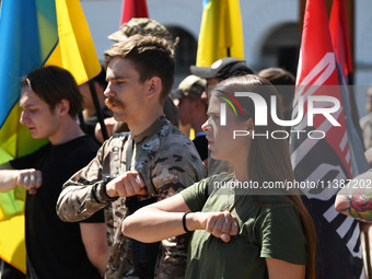 People are shouting slogans during a funeral ceremony for British volunteer and combat medic Peter Fouche at Independence Square in Kyiv, Uk...