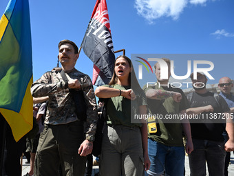 People are shouting slogans during a funeral ceremony for British volunteer and combat medic Peter Fouche at Independence Square in Kyiv, Uk...