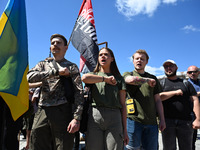 People are shouting slogans during a funeral ceremony for British volunteer and combat medic Peter Fouche at Independence Square in Kyiv, Uk...