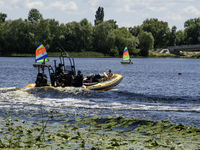 A rescue boat is standing guard near the beach on the banks of the Dnipro River in Kyiv, Ukraine, on July 06, 2024 (