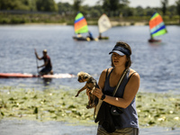 People are relaxing on the beach on the banks of the Dnipro River in Kyiv, Ukraine, on July 06, 2024. Heatwaves of up to 40 degrees Celsius...