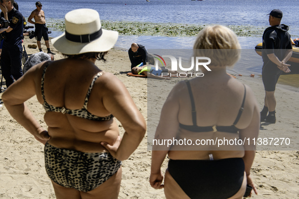 Rescuers are conducting a drowning exercise at a beach on the banks of the Dnipro River in Kyiv, Ukraine, on July 06, 2024 