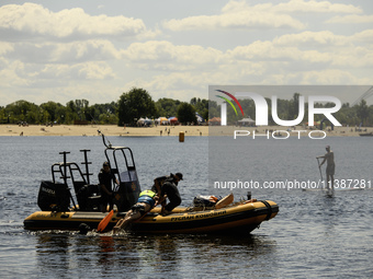 Rescuers are conducting a drowning exercise at a beach on the banks of the Dnipro River in Kyiv, Ukraine, on July 06, 2024 (