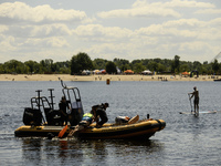 Rescuers are conducting a drowning exercise at a beach on the banks of the Dnipro River in Kyiv, Ukraine, on July 06, 2024 (