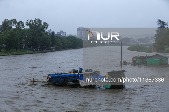 A shop is being partially submerged in Kathmandu, Nepal, on July 6, 2024. 