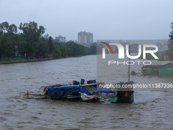 A shop is being partially submerged in Kathmandu, Nepal, on July 6, 2024. (