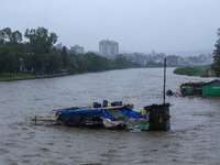 A shop is being partially submerged in Kathmandu, Nepal, on July 6, 2024. (