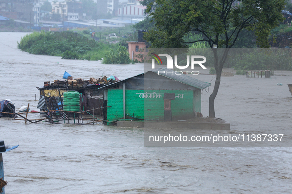 A public toilet is being partially submerged in Kathmandu, Nepal, on July 6, 2024 