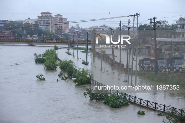 Flooding is submerging a section of road in Kathmandu, Nepal, on July 6, 2024. 