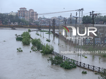 Flooding is submerging a section of road in Kathmandu, Nepal, on July 6, 2024. (