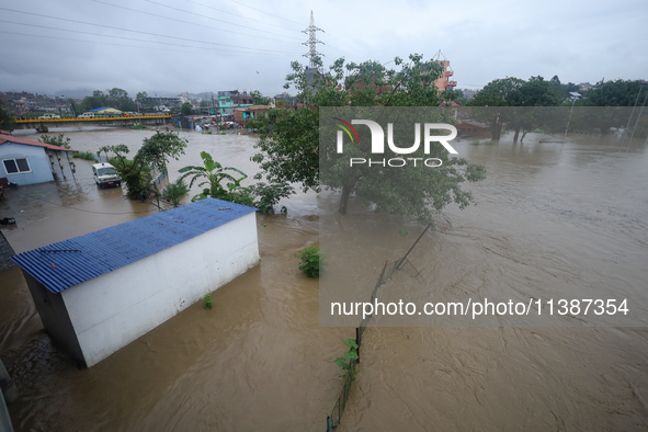 Flooding is submerging a section of road in Kathmandu, Nepal, on July 6, 2024. 