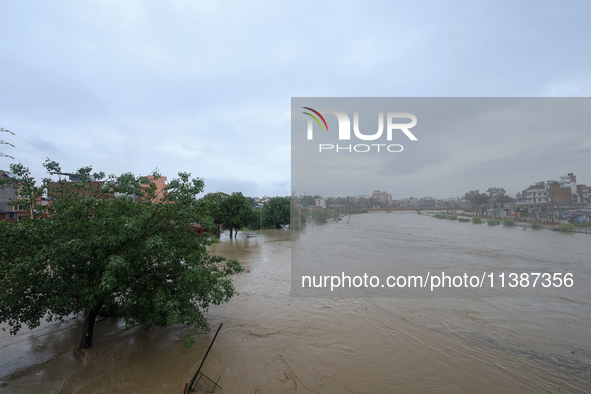 Flooding is submerging a section of road in Kathmandu, Nepal, on July 6, 2024. 