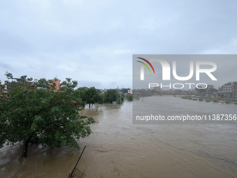 Flooding is submerging a section of road in Kathmandu, Nepal, on July 6, 2024. (