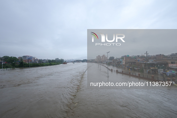 Flooding is submerging a section of road in Kathmandu, Nepal, on July 6, 2024. 