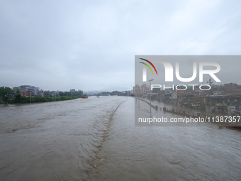 Flooding is submerging a section of road in Kathmandu, Nepal, on July 6, 2024. (