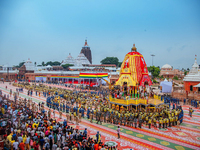 Newly built wooden chariots of Lord Balabhadra, Devi Subhadra, and Lord Jagannath are being seen in front of the Shree Jagannath Temple on t...